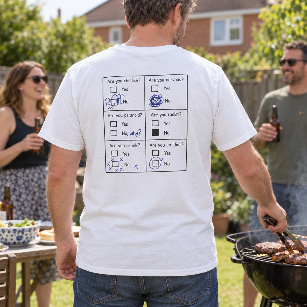 Lifestyle mockup of a man wearing the white questionnaire back-print T-shirt at a garden BBQ.