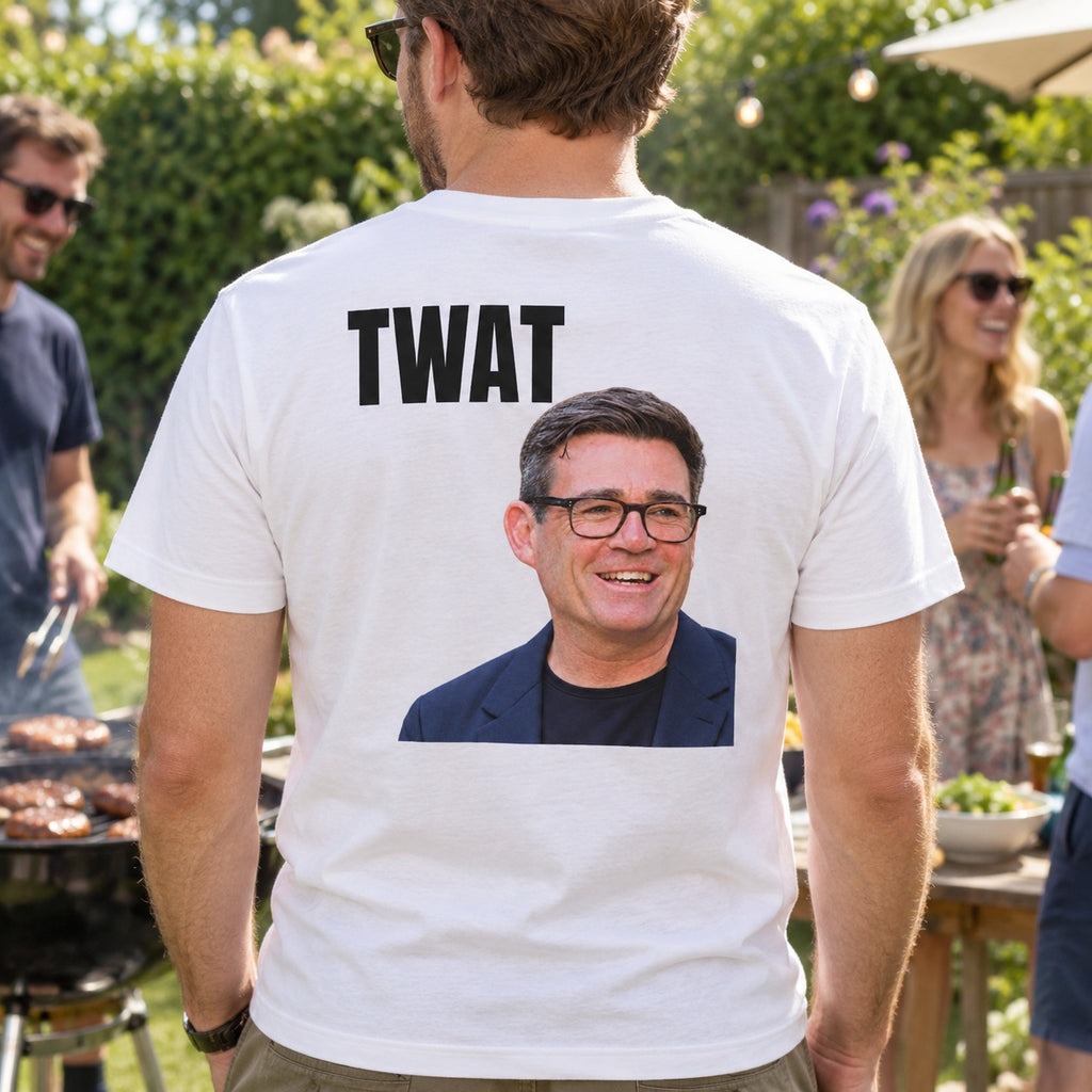 AI-generated lifestyle mockup of a man wearing the white TWAT portrait back-print T-shirt at a garden barbecue.